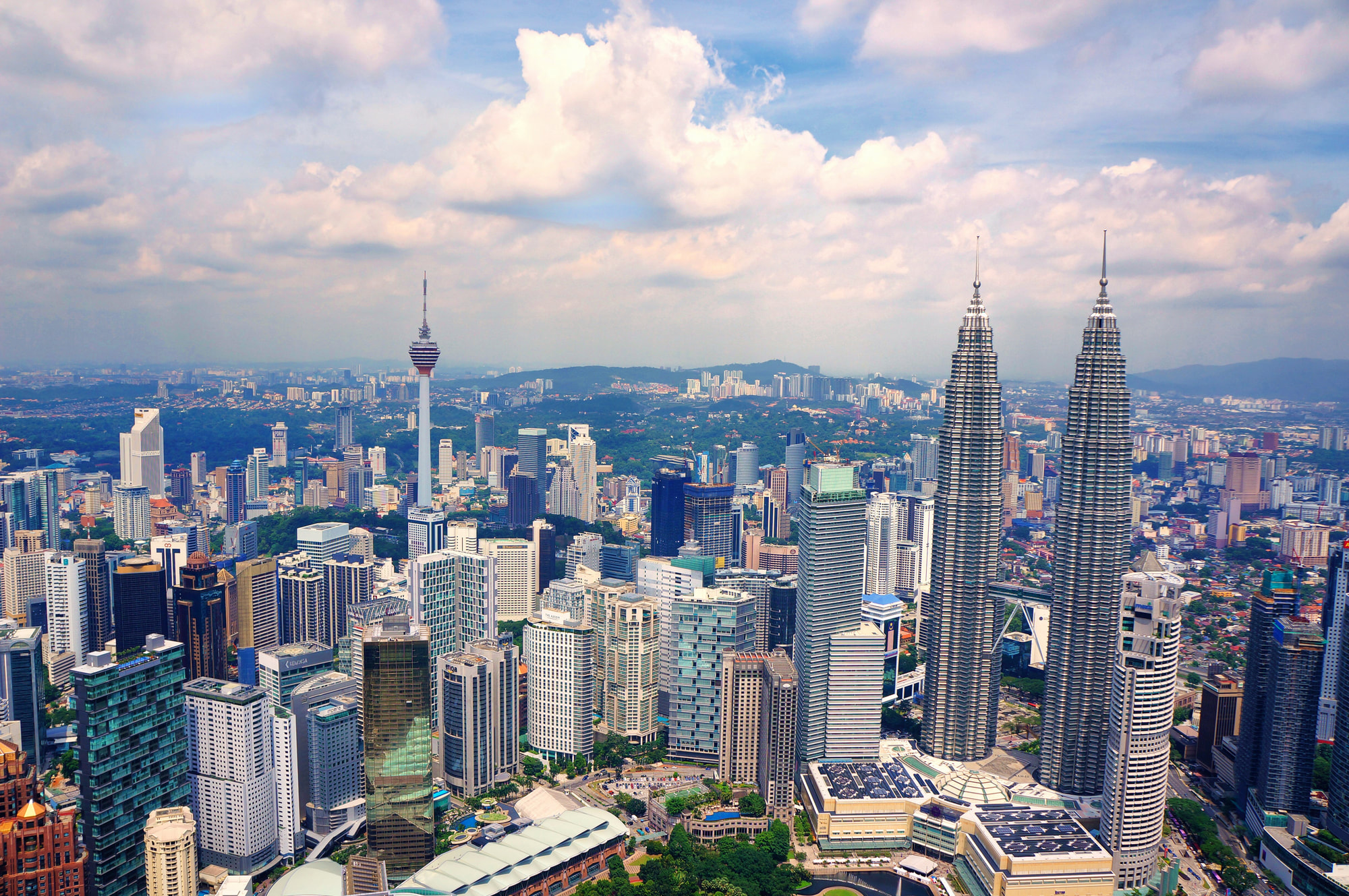 Kuala Lumpur city skyline with the Petronas Twin Towers and KL Tower