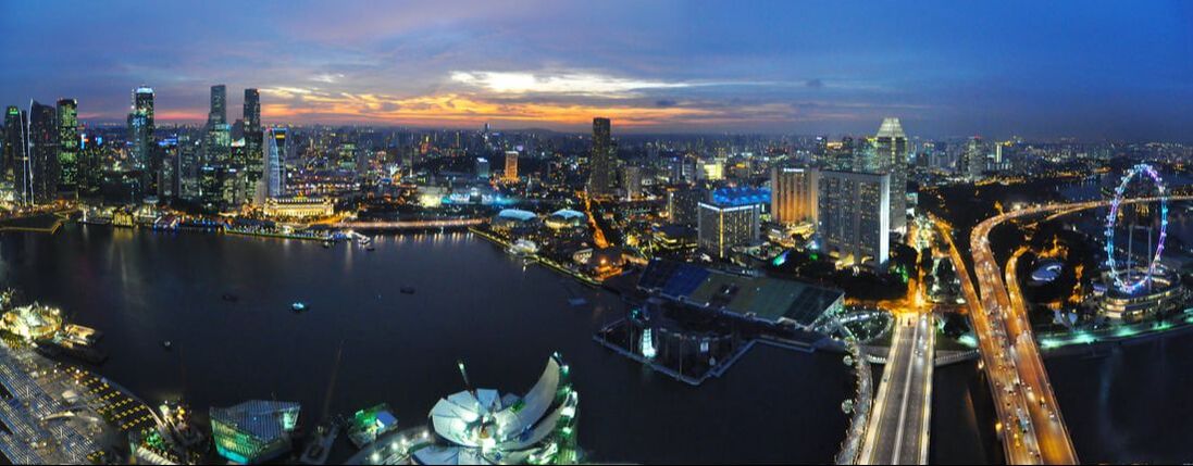 Singapore skyline at dusk overlooking Marina Bay